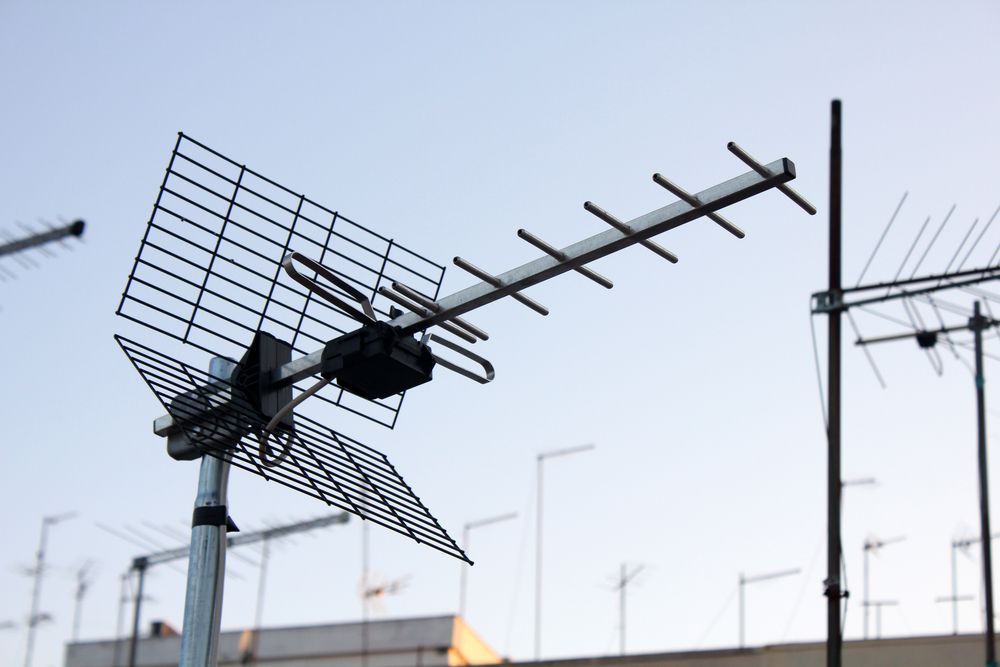 A Large Antenna is Sitting on Top of a Metal Pole — Joytech In Adelaide, SA