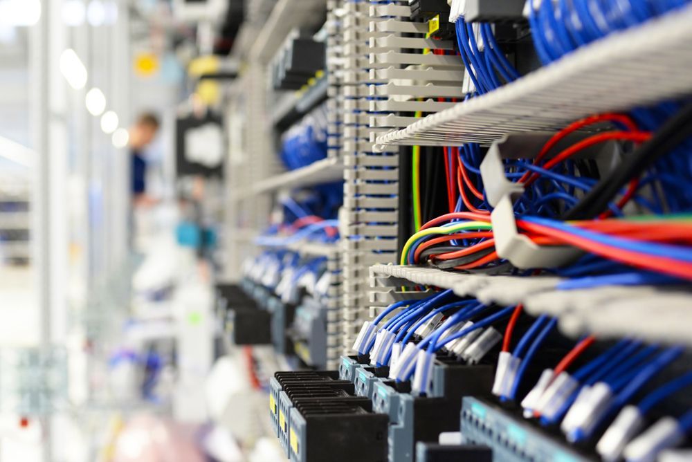 A Bunch Of Wires Are Sitting On A Shelf In A Room — Joytech In Ciccone, NT
