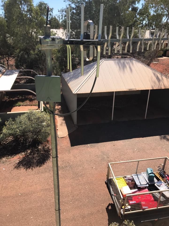 An Aerial View Of A Building With Antennas On Top Of It — Joytech In Ciccone, NT