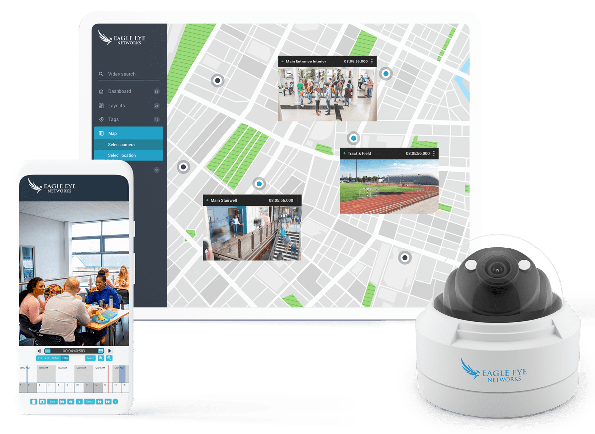 A security camera is sitting next to a cell phone and a map.