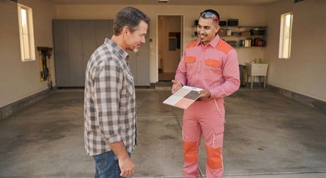 Madera epoxy flooring technician discussing an estimate with a homeowner