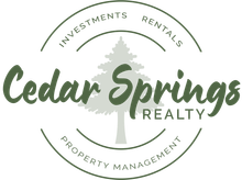 Logo for Cedar Springs Realty with a tree graphic, and text 