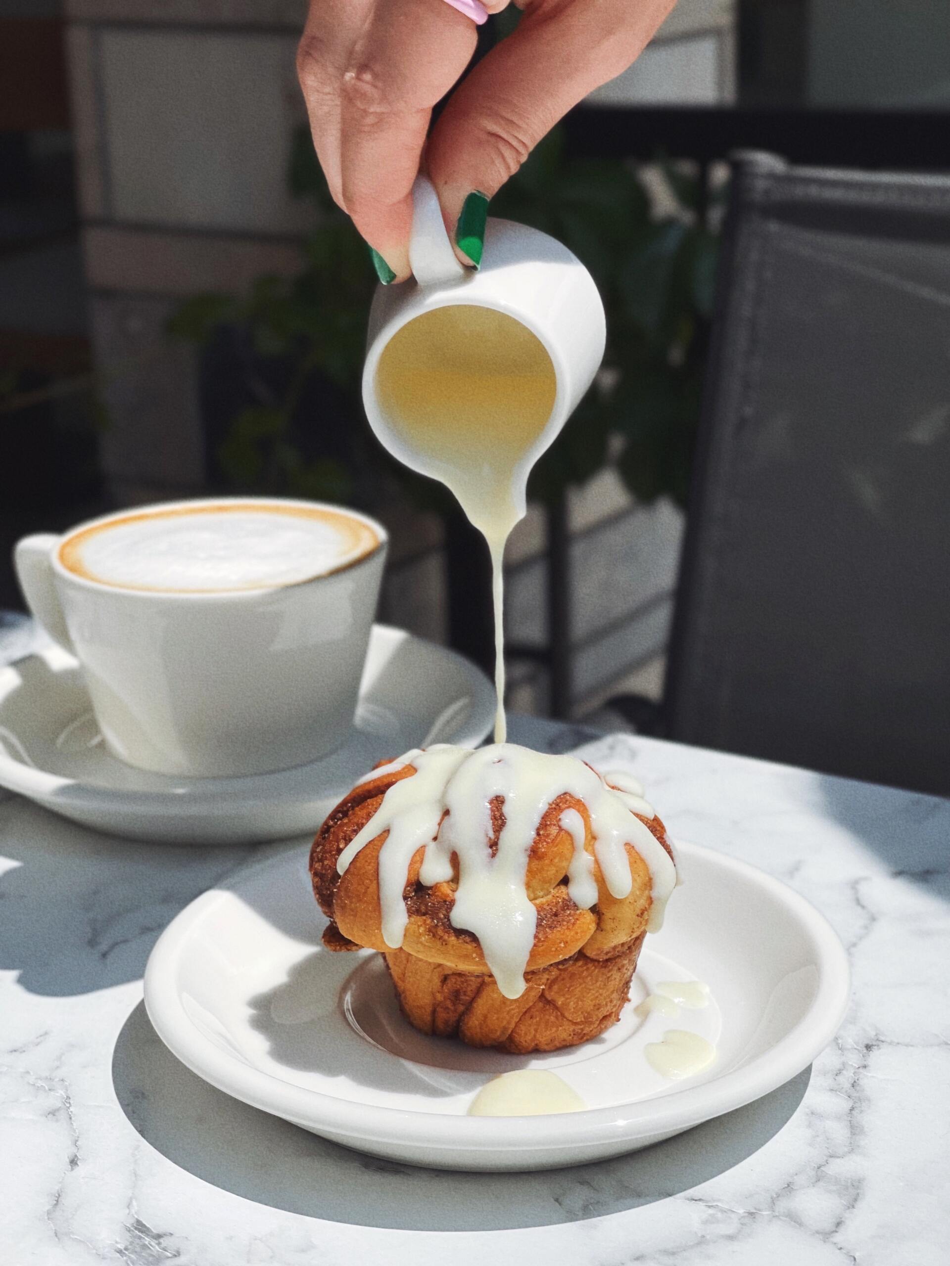 Pouring cream on muffin