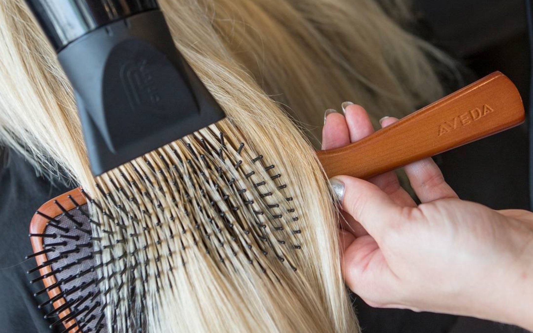 Aveda paddle brush being used during a professional blow-dry at Salon Cabelo in Farnham