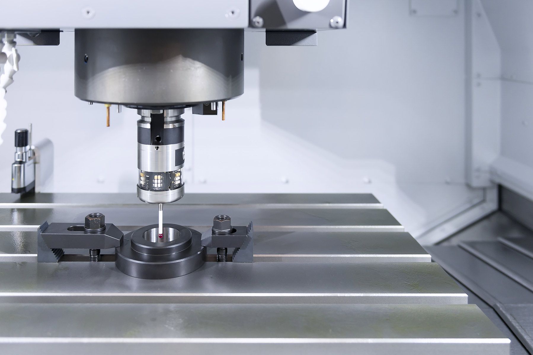 A Machine Is Cutting A Piece Of Metal On A Table — The Sewing Machine Doctor In Forest Glen, QLD