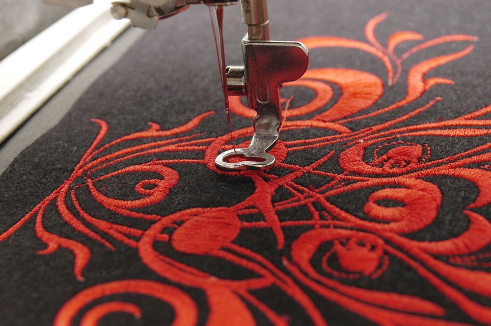 A Close Up Of A Sewing Machine With Red Embroidery — The Sewing Machine Doctor In Sunshine Coast, QLD
