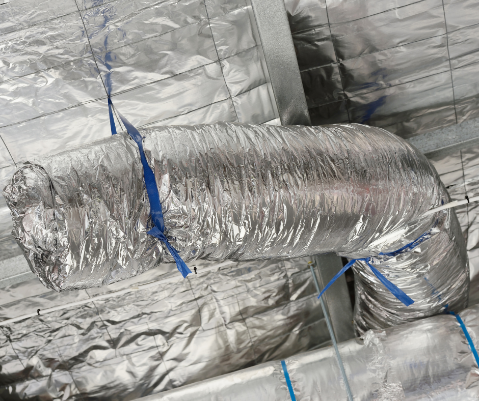 A close up of a silver duct with blue straps attached to it.