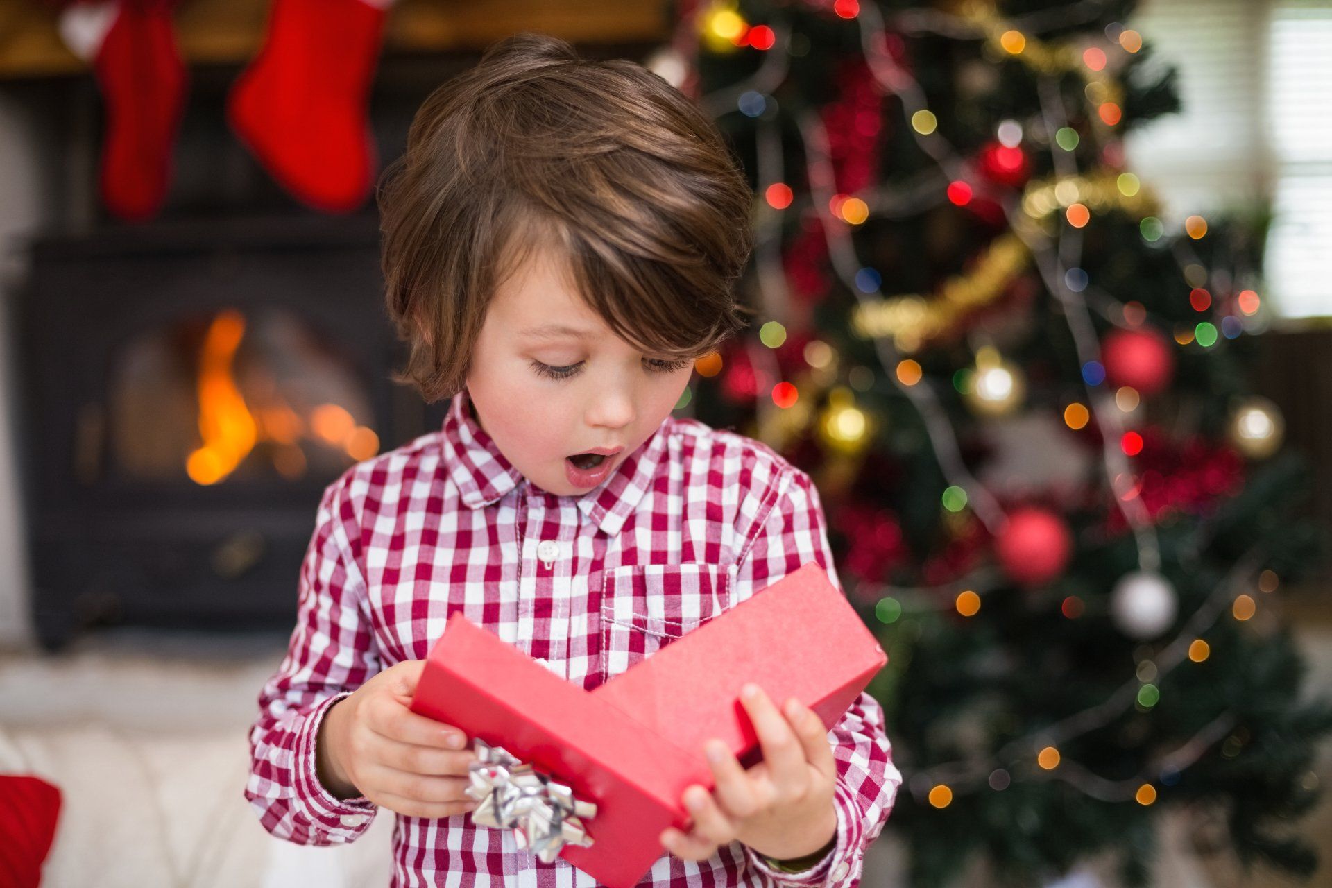 Child opening up a present
