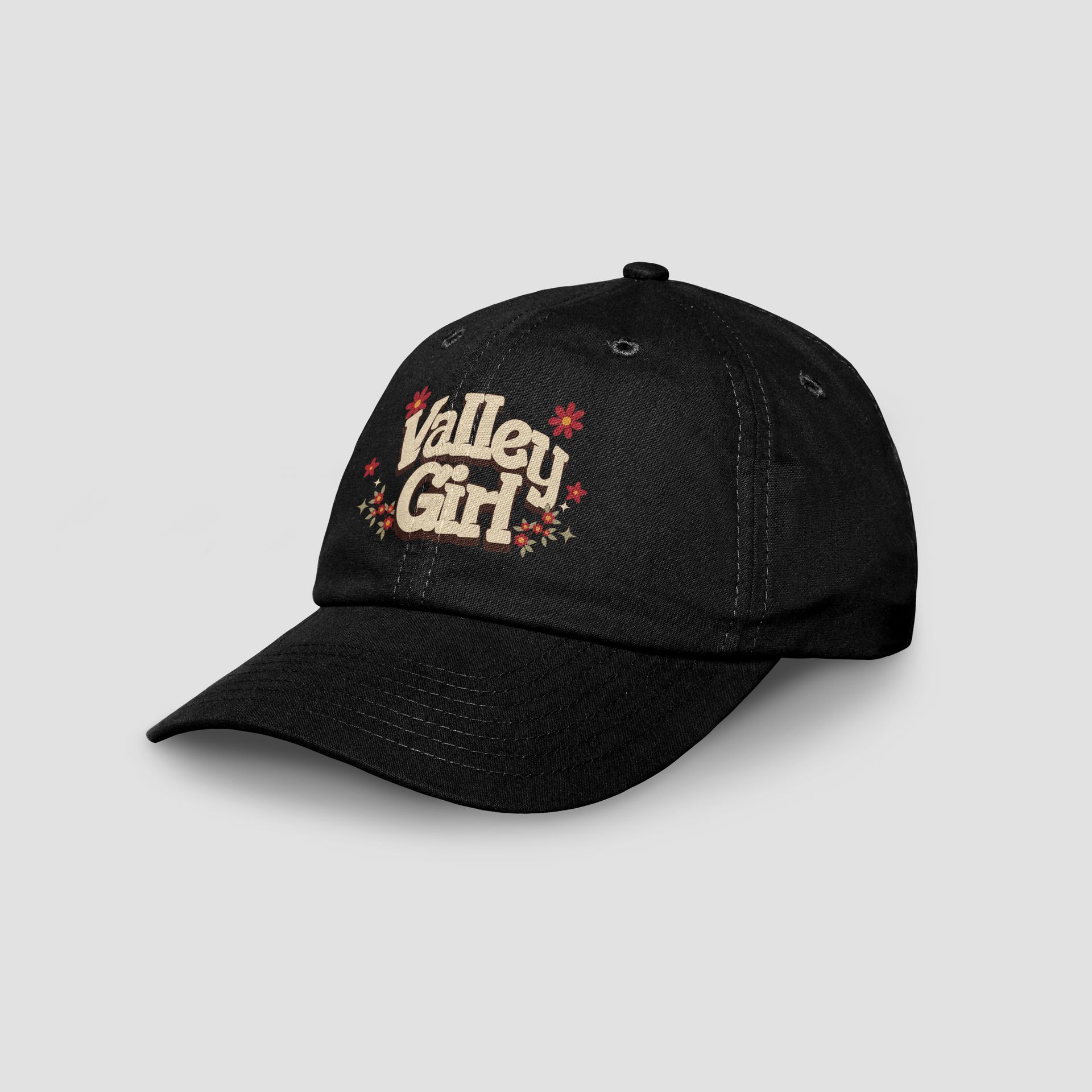 A black baseball cap that says valley girl on it