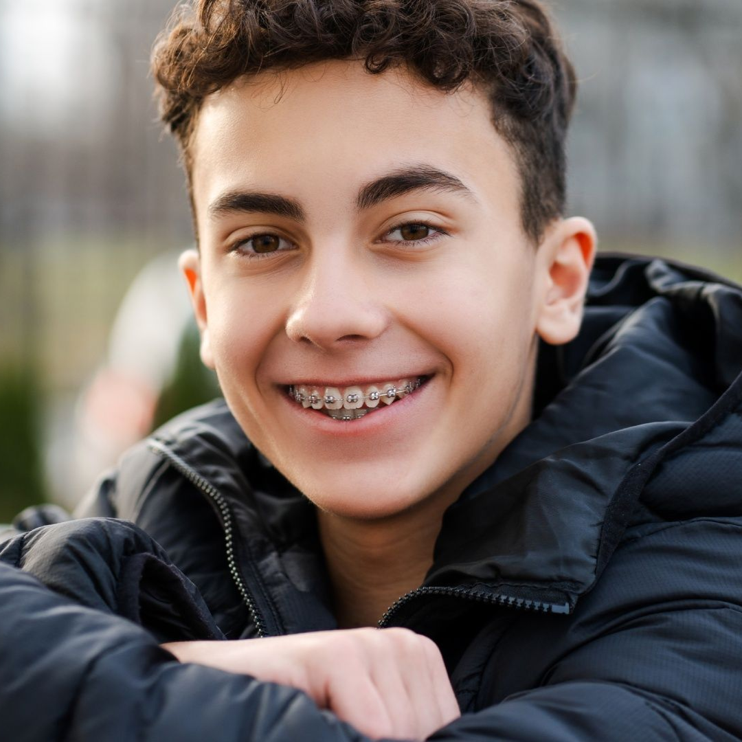 Teen smiling showing his braces in Pepper Pike, OH