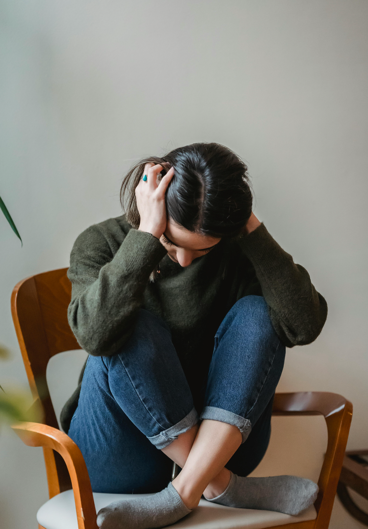Woman Who Is Crying While Sitting On A Couch — Rural Medical Clinic In Manilla, NSW