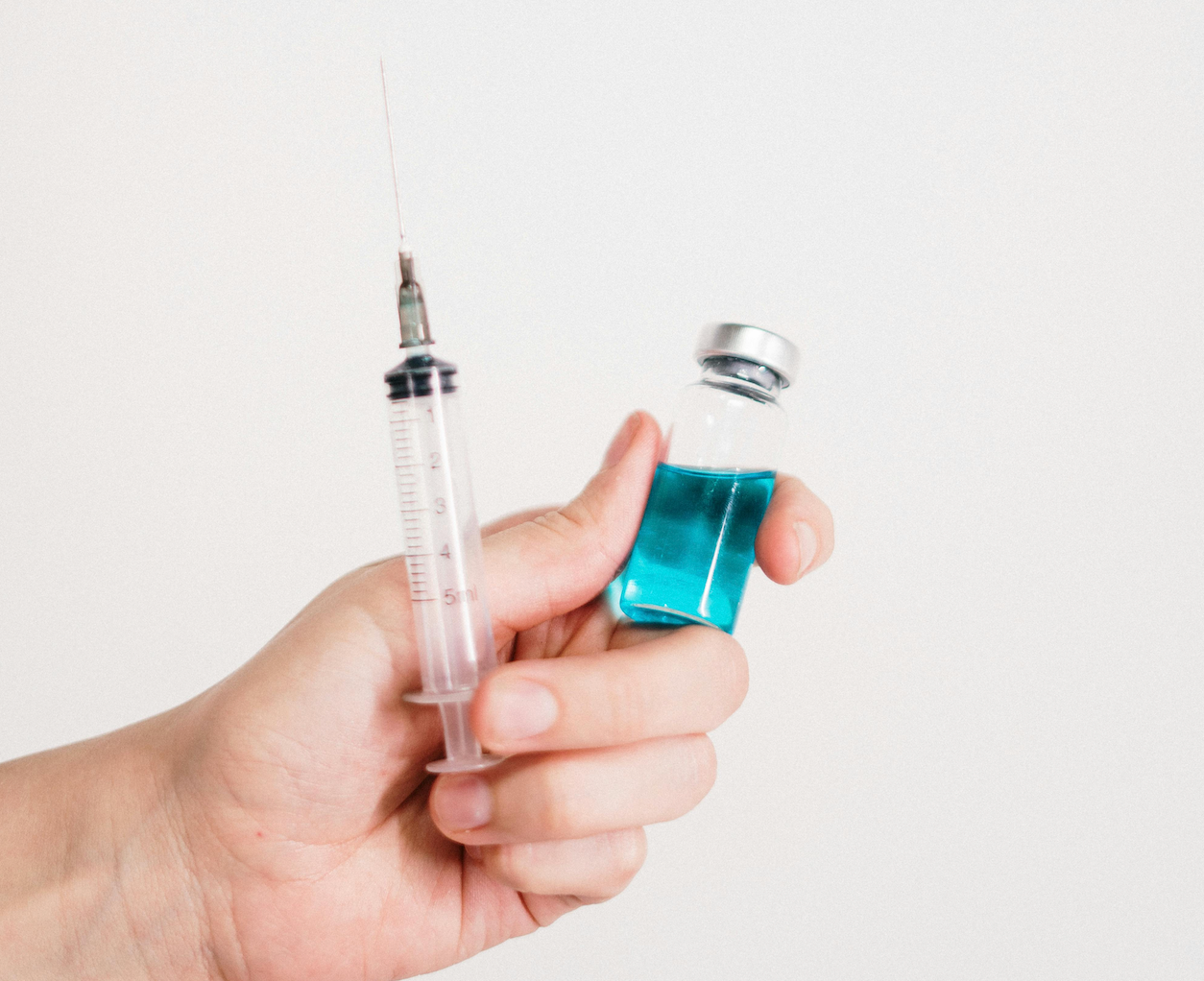A Syringe Is Being Used To Inject A Vaccine Into A Bottle โ Rural Medical Clinic In Manilla, NSW