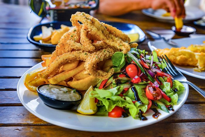 Salt and pepper calamari with salad and chips
