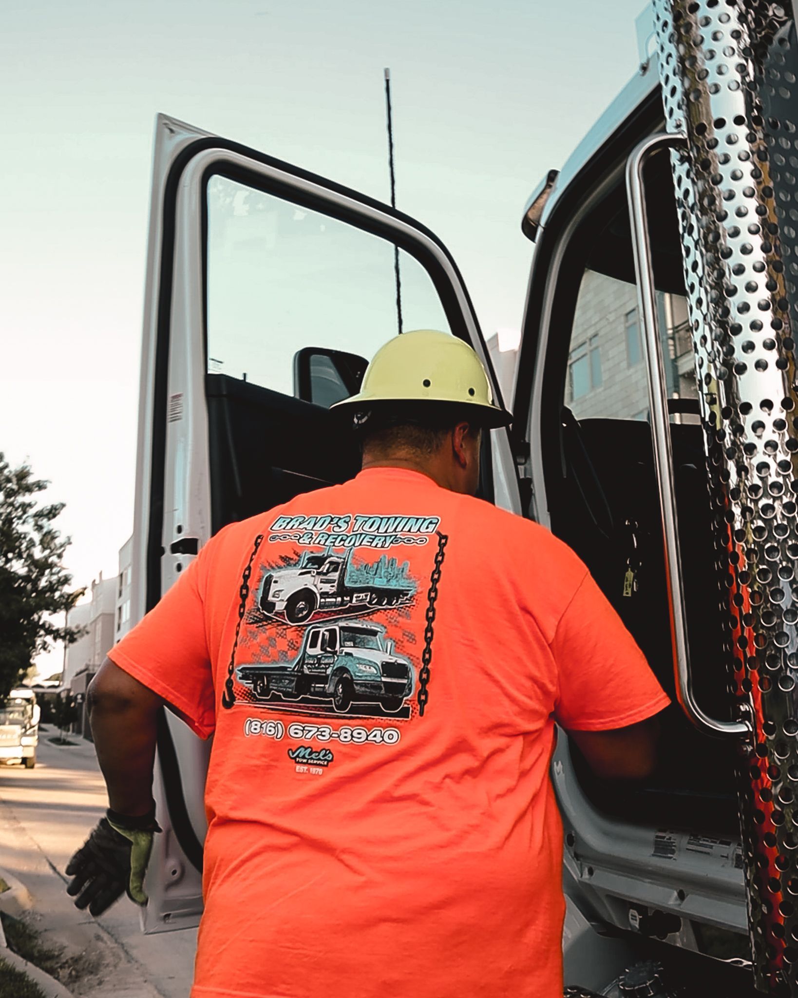 A man wearing an orange t-shirt that says texas reaper