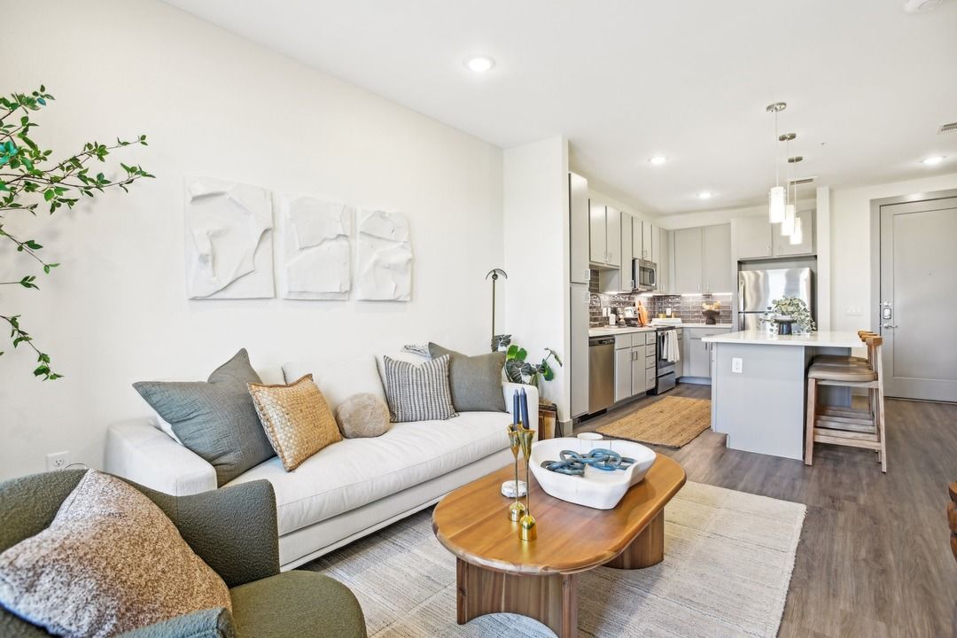 A living room with a couch and a table
