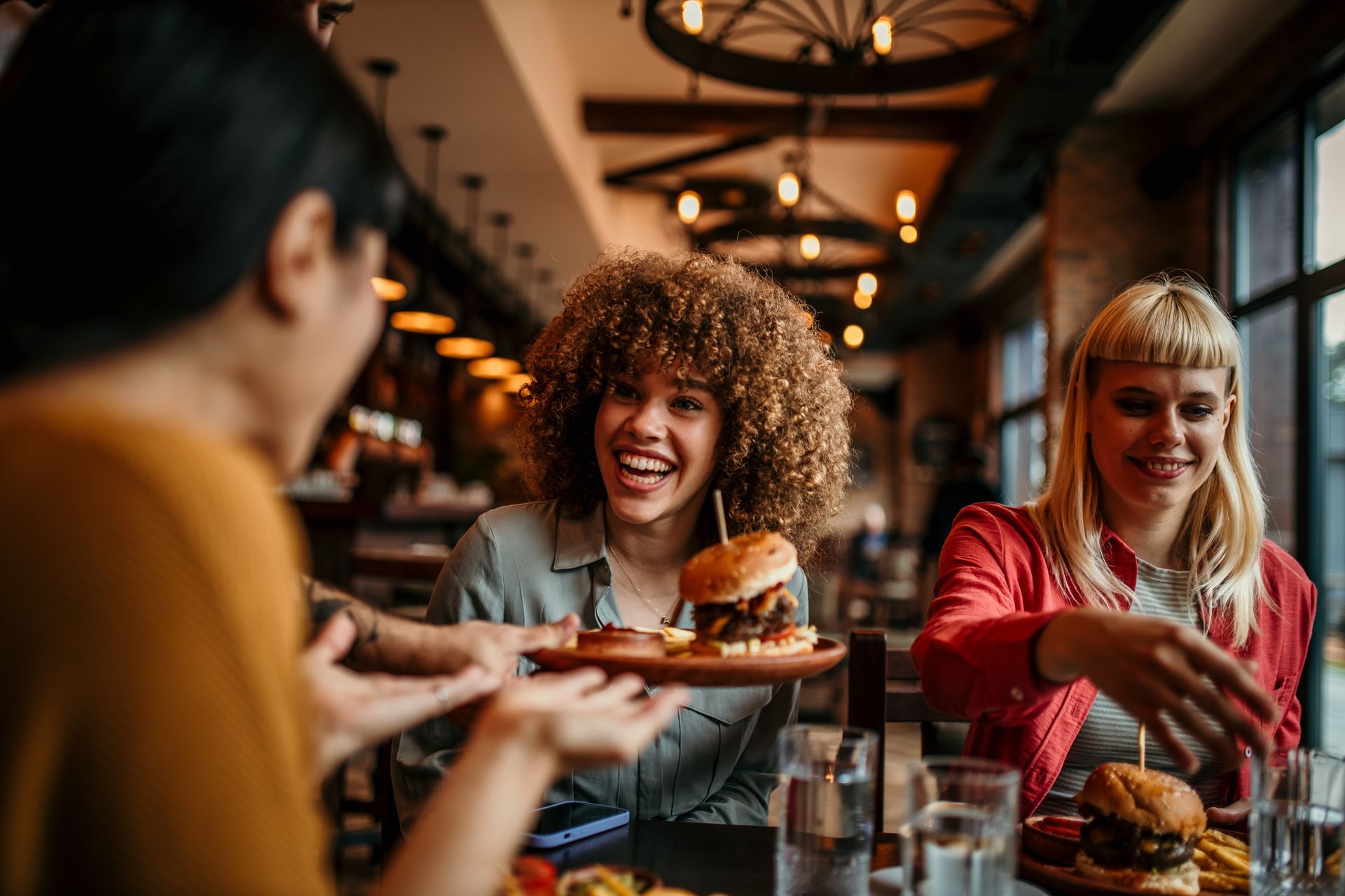 residents dining together at a restaurant table.