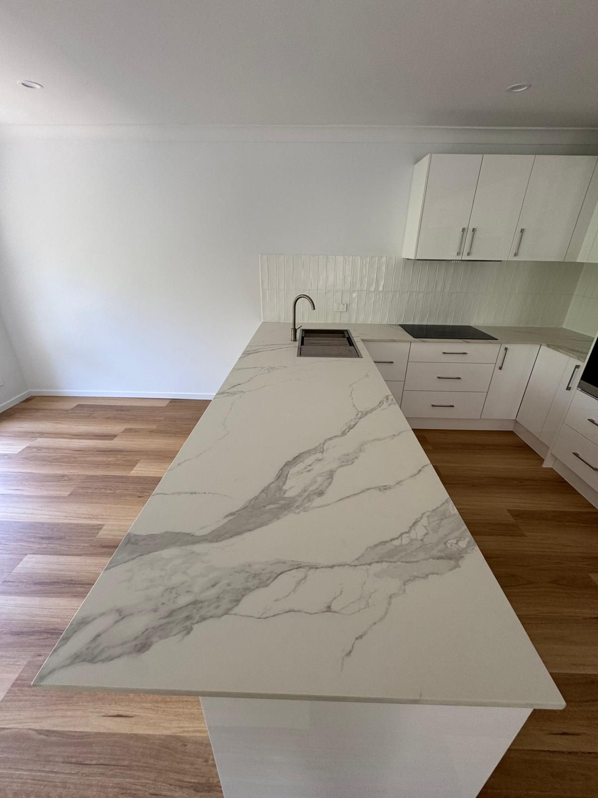 Renovated bathroom featuring stone tiles - Bathroom Renovations Gold Coast