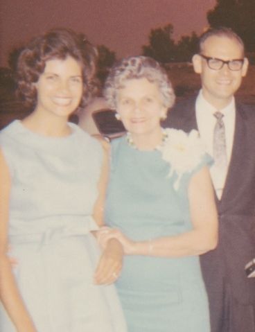 Three people: woman in blue dress, older woman with corsage, man in suit, outside, smiling. Marlene Heinz, Elsie Jacobsen, Donald Jacobsen