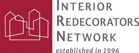 Logo for the Interior Redecorators Network, featuring white house outlines on a burgundy background, and text.
