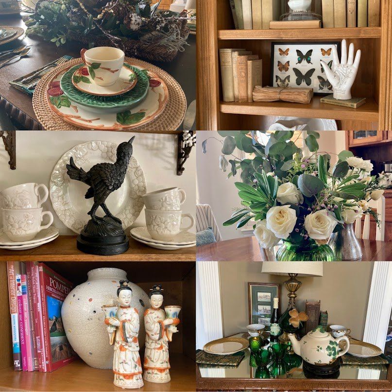 Arrangement of vintage decor, including china, books, flowers, and figurines, displayed in a home setting.