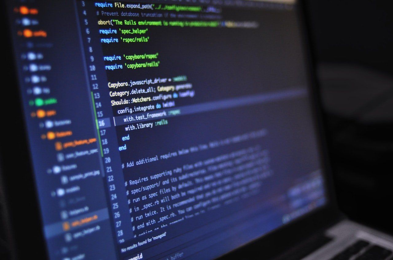 A dark-themed computer screen displaying lines of programming code in an integrated development environment.