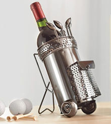 Stainless steel wine caddy holding a bottle, glasses, and accessories on a light tabletop