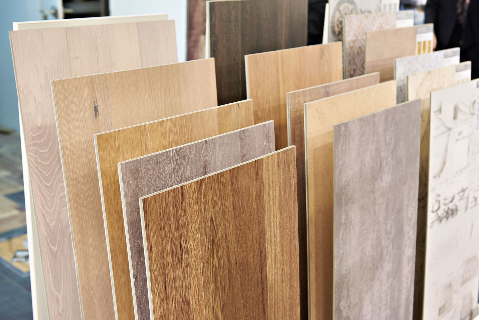 Samples of wood flooring in various colors and textures on display.