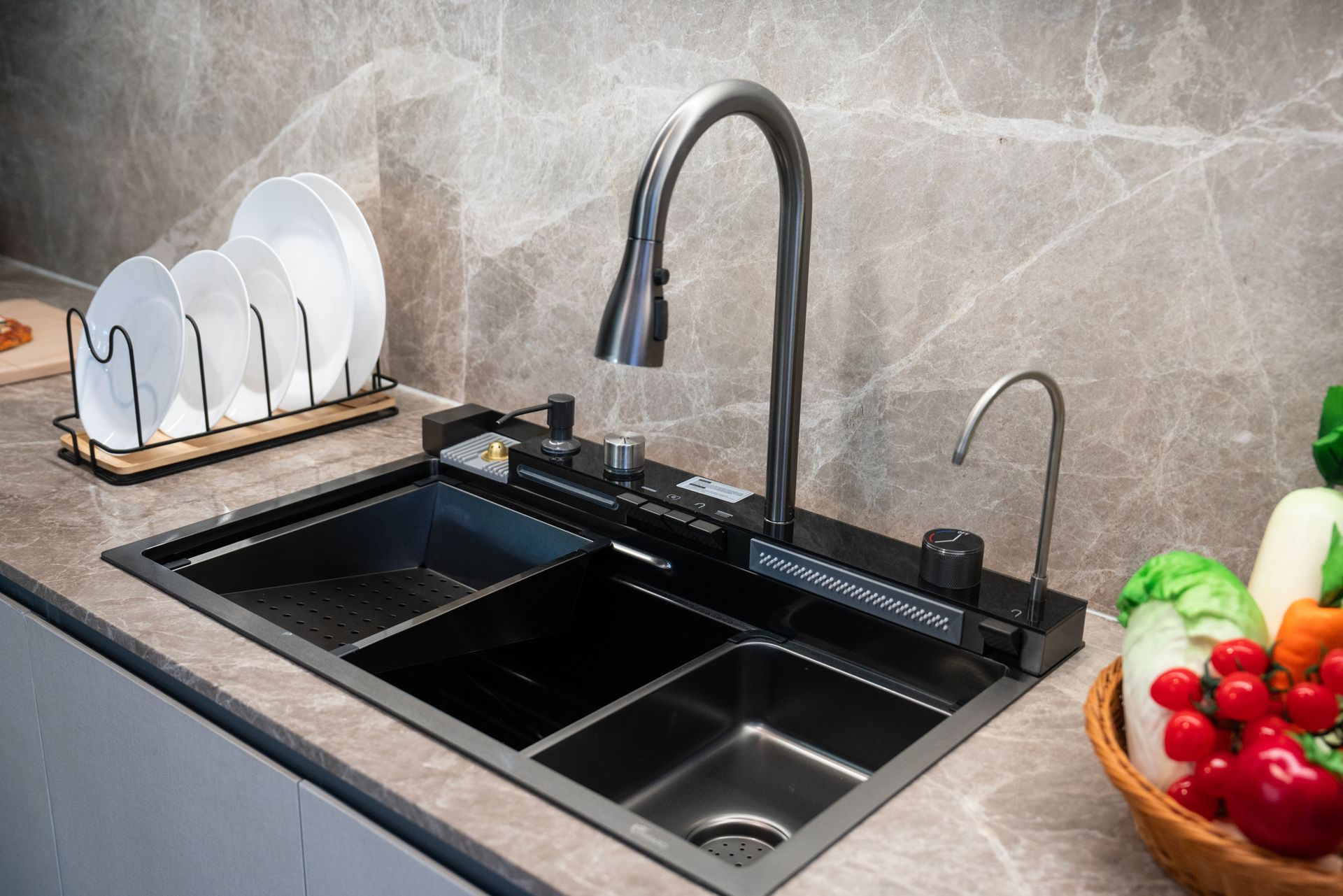 A kitchen sink with a faucet and a bowl of vegetables on the counter.