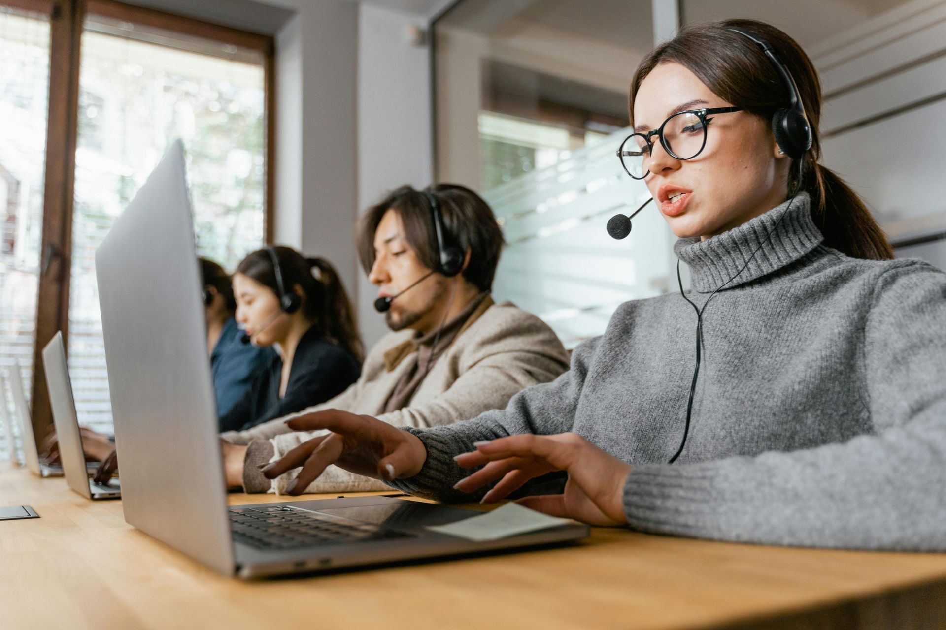 A team of agents in a call center helping clients.