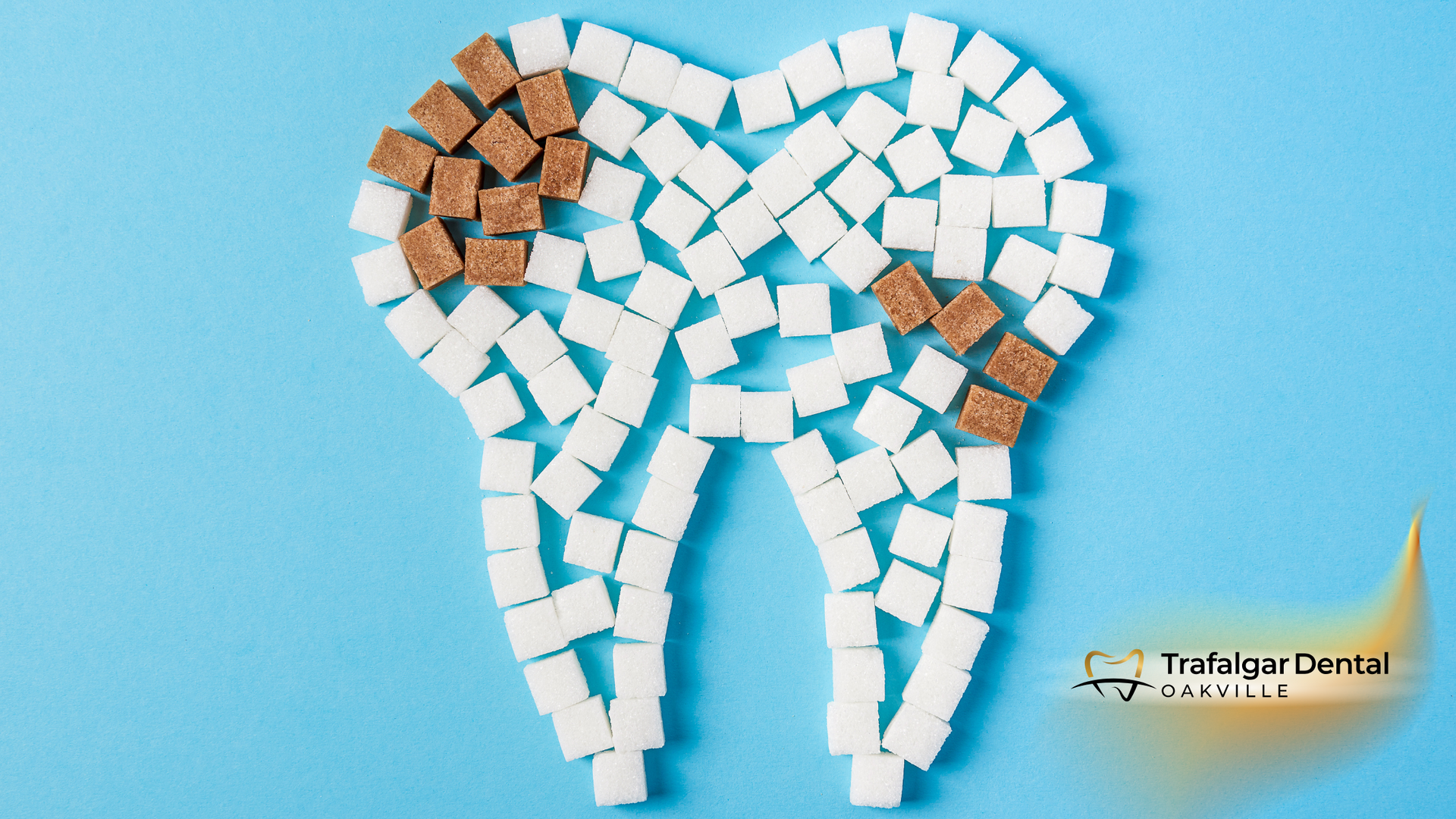 A tooth made out of sugar cubes on a blue background