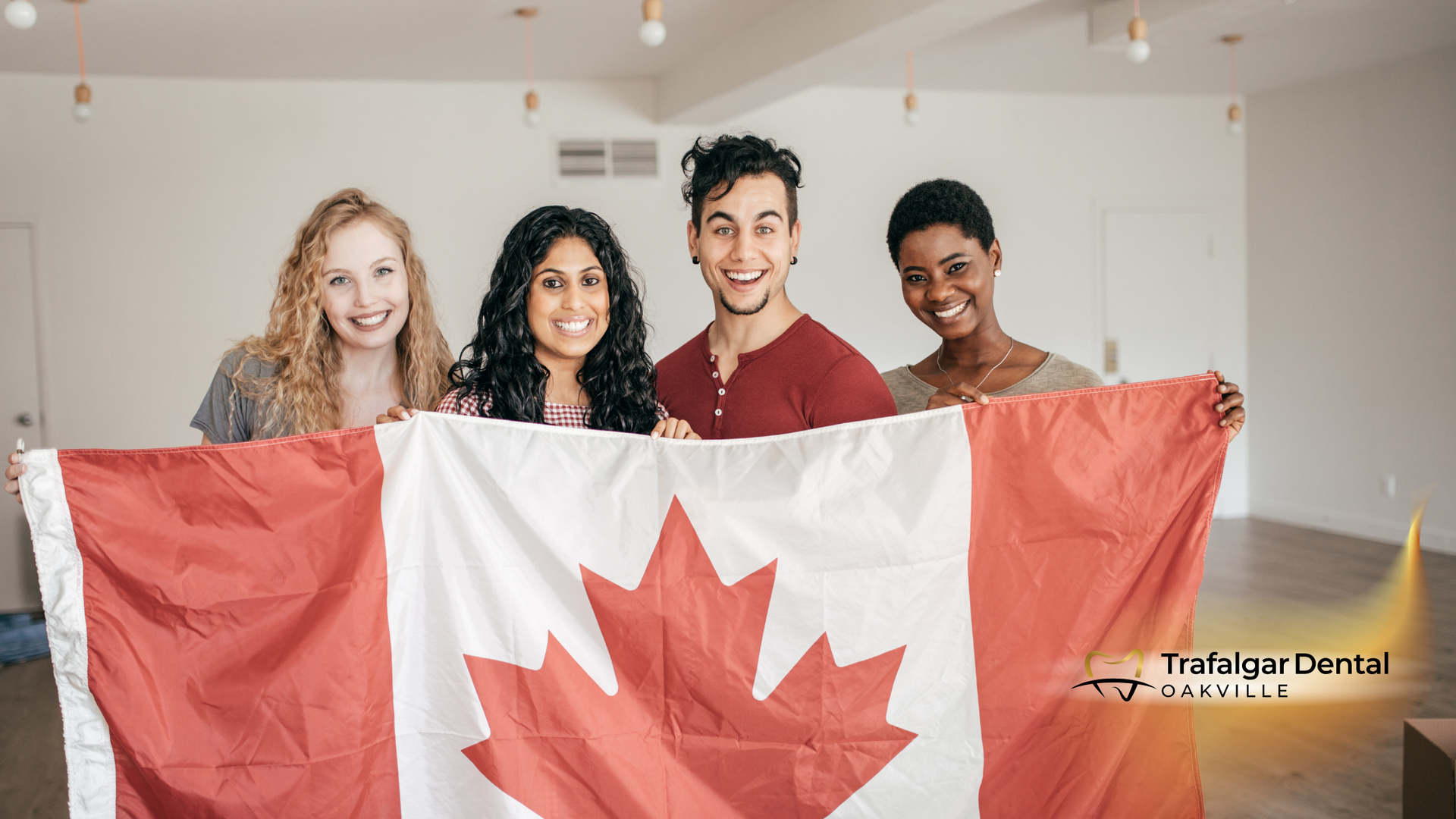 A group of young people are holding a canadian flag.