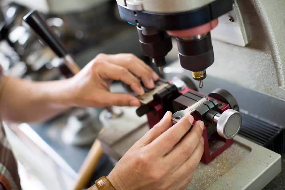 a Person is Using a Machine to Make a Key — Armstrong Locksmiths Ballarat In Bacchus Marsh, VIC