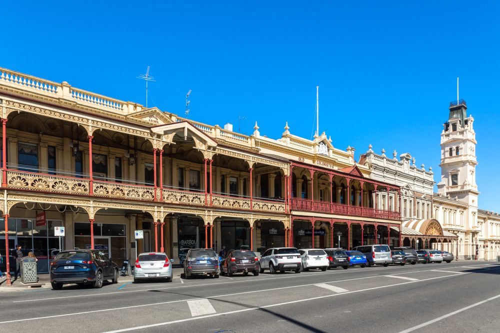 a Row of Cars Are Parked in Front of a Large Building — Armstrong Locksmiths Ballarat in Ballarat East, VIC