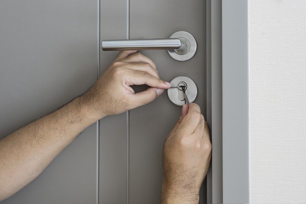 Locksmith Trying To Fix Locked Door — Armstrong Locksmiths Ballarat in Ballarat East, VIC