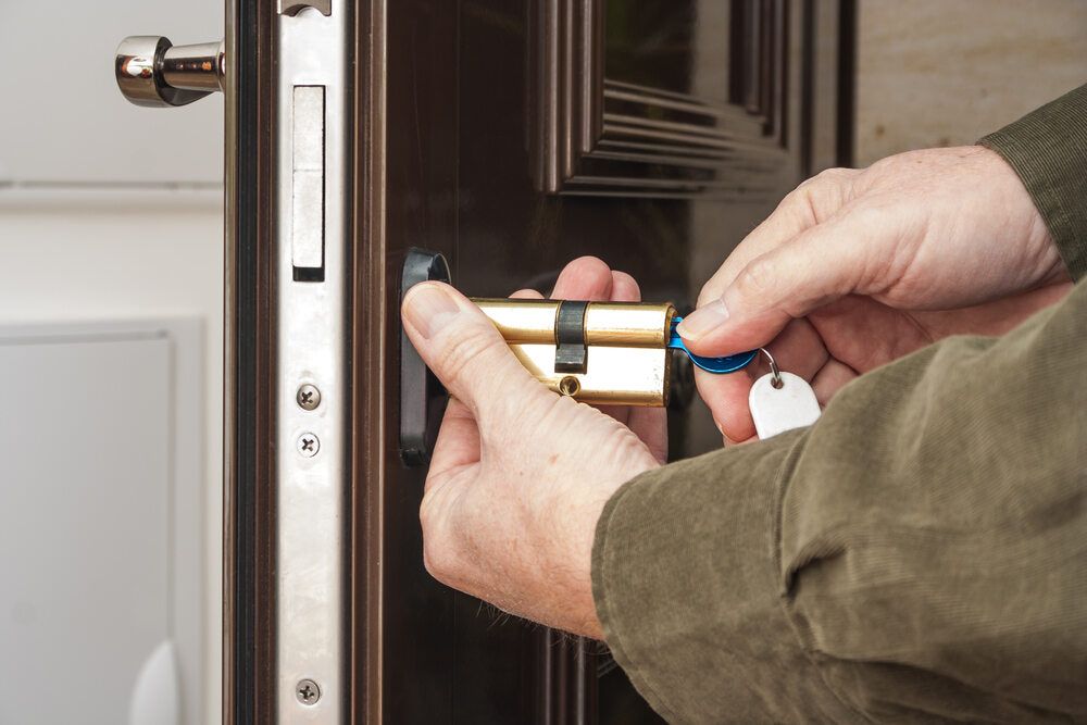 Locksmith Unlocking a  Wooden Doors — Armstrong Locksmiths Ballarat in Ballarat East, VIC