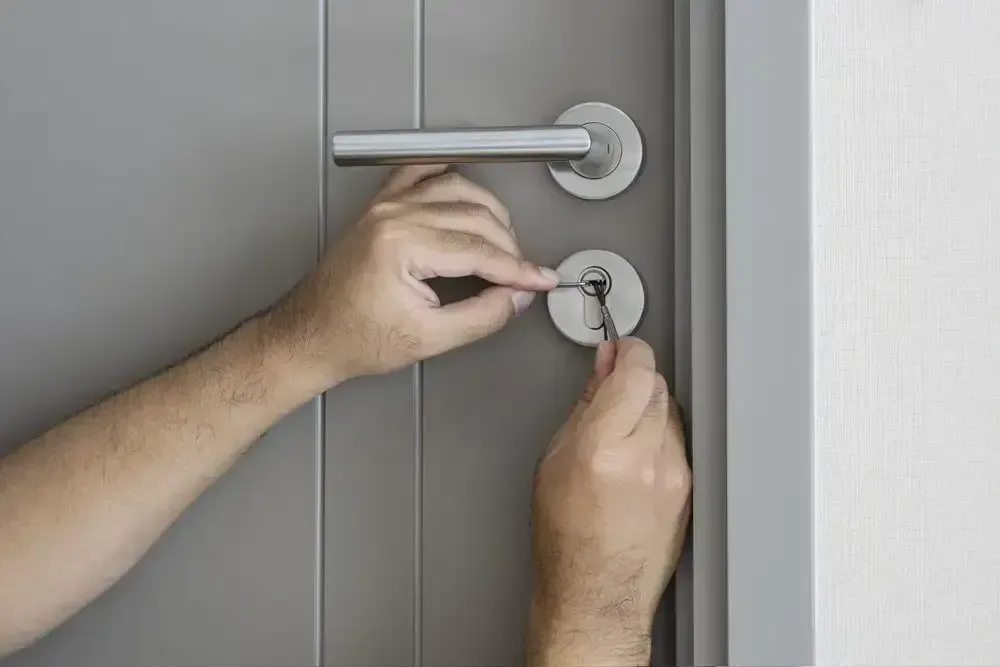 Residential Locksmith Fixing Lock On House Door — Armstrong Locksmiths Ballarat in Ballarat East, VIC