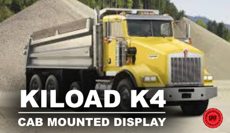 A yellow dump truck is parked in front of a pile of gravel.