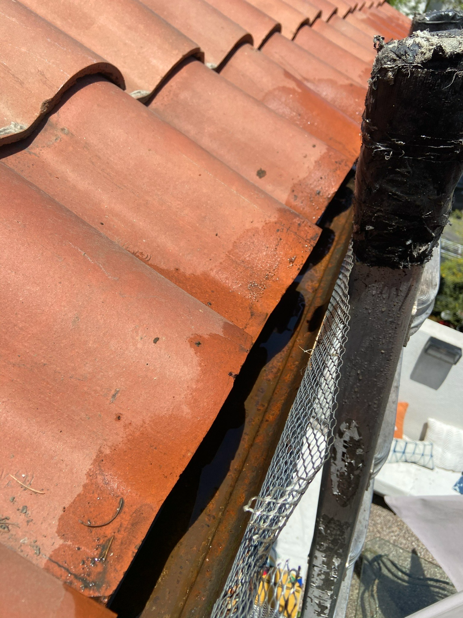 A Close Up Of A Roof With A Gutter On It