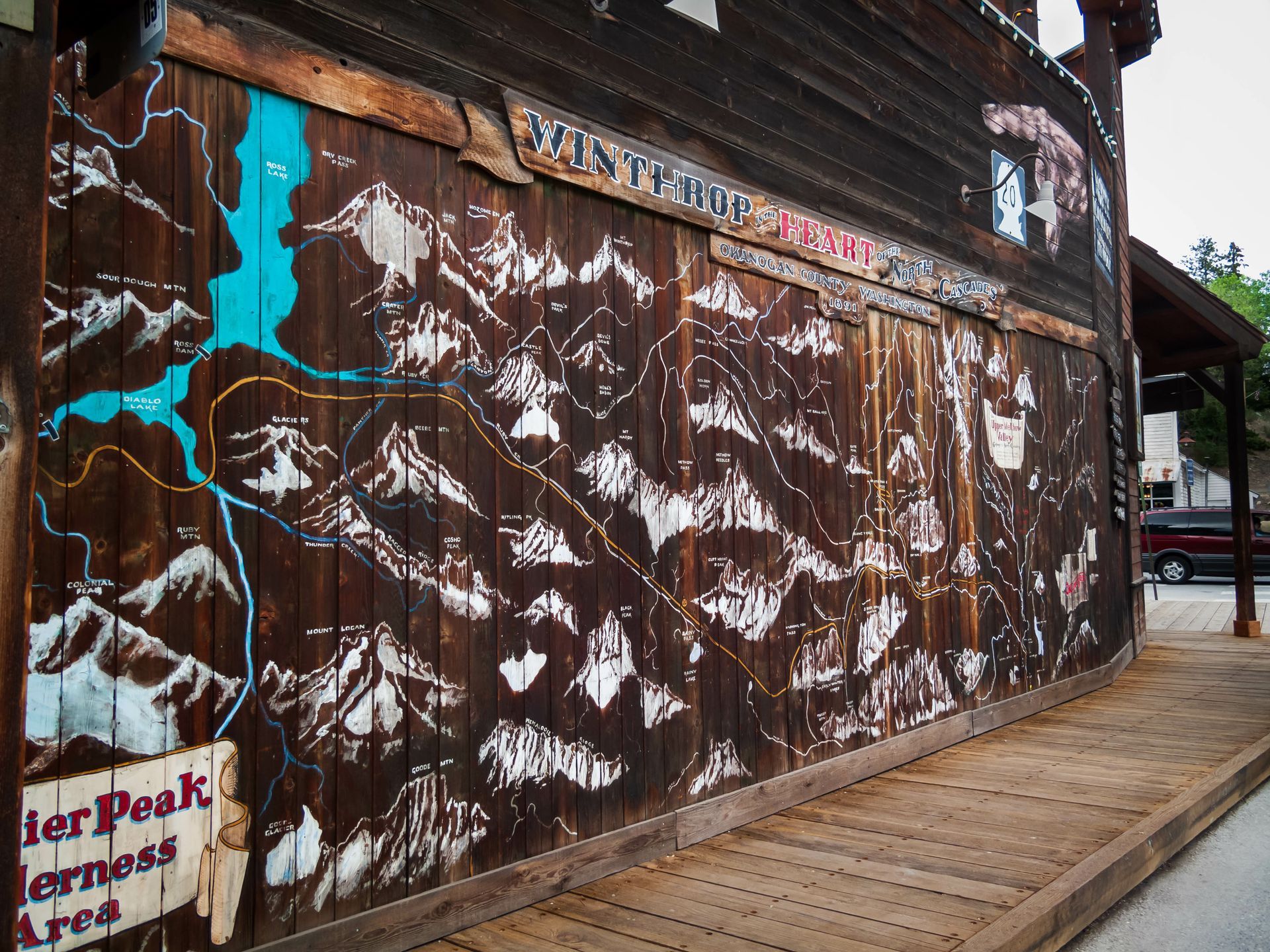 A welcome sign with a cowboy on a bucking horse
