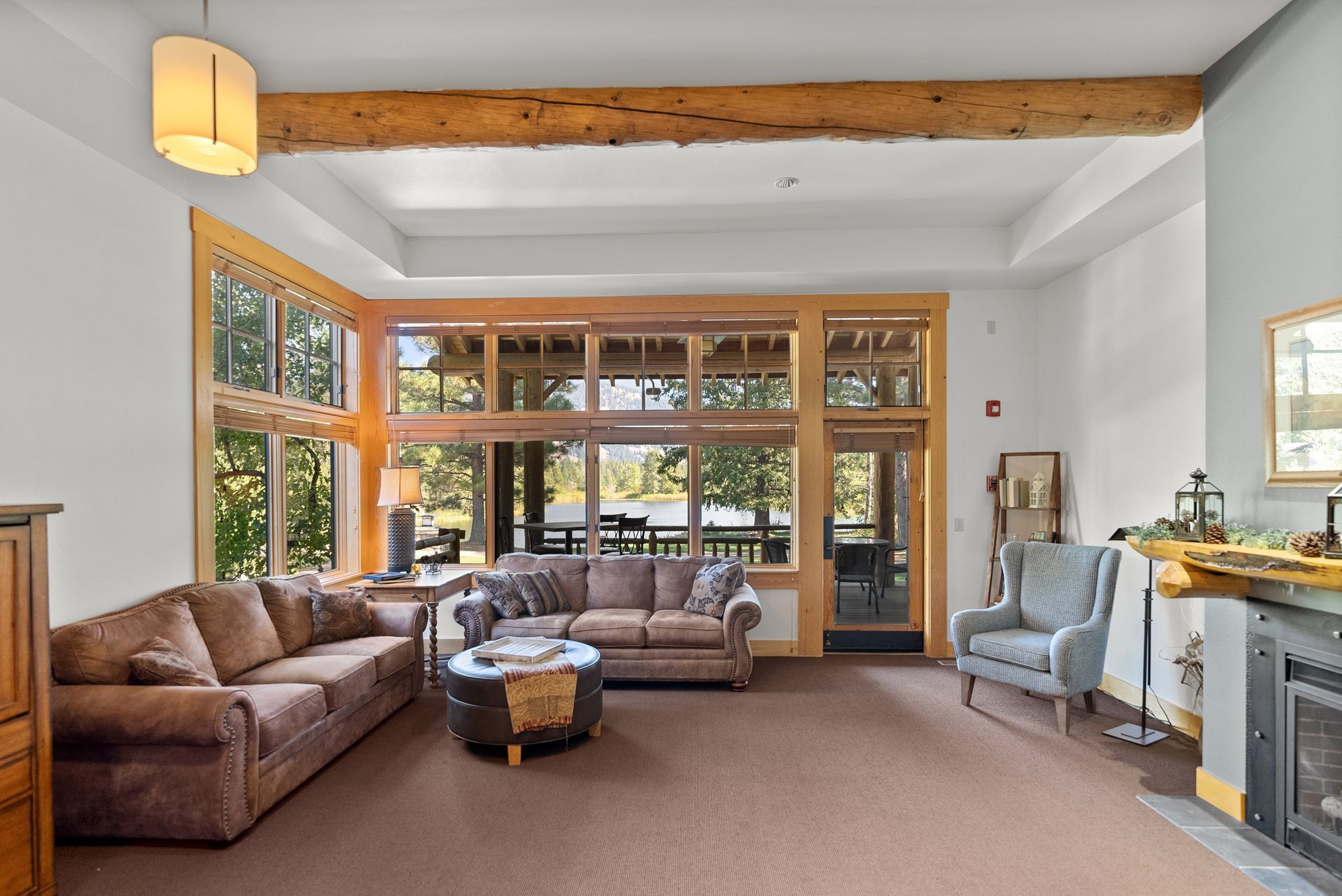 A living room with a lot of furniture and a fireplace.