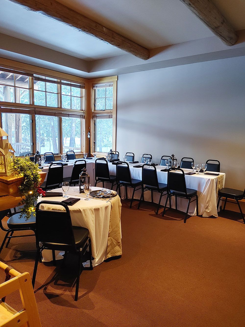 A room with tables and chairs set up for a party