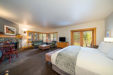 There is a king size bed in the middle of the room.