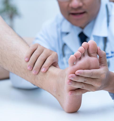 Doctor Examining Patient's Foot | Sheffield, AL | Martin Foot Specialists, Inc Doctor Examining Patient's Foot | Sheffield, AL | Martin Foot Specialists, Inc