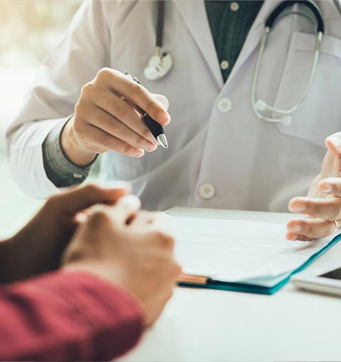 Doctor with Patient's Form | Sheffield, AL | Martin Foot Specialists, Inc Doctor with Patient's Form | Sheffield, AL | Martin Foot Specialists, Inc