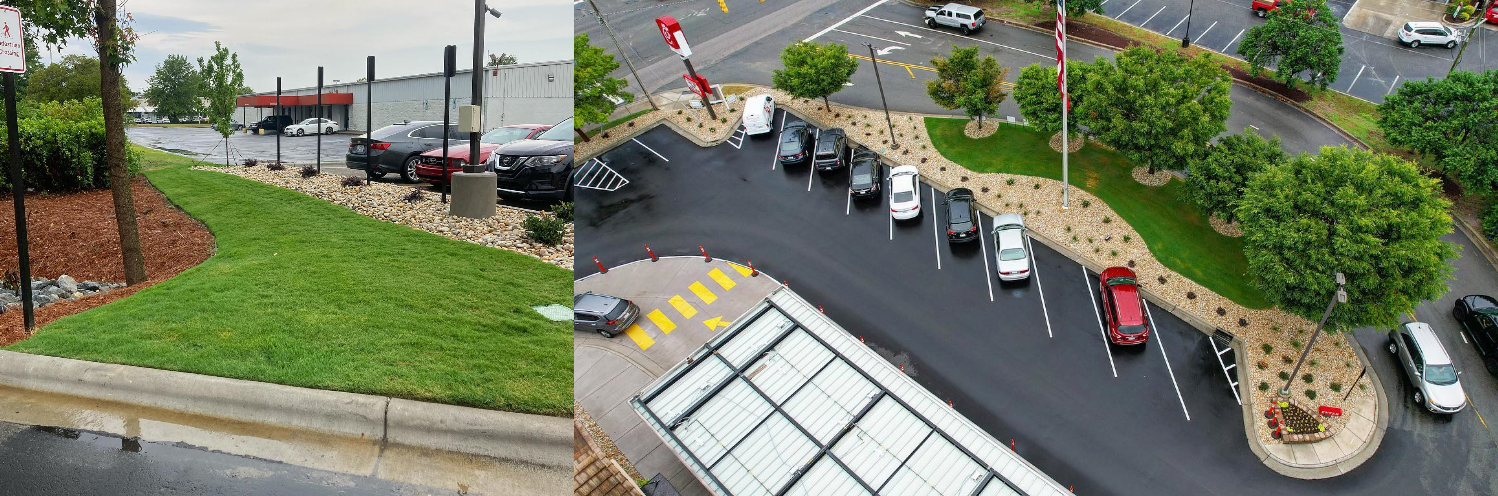 Aerial view of a landscaped parking lot with several cars beside a road and green trees.