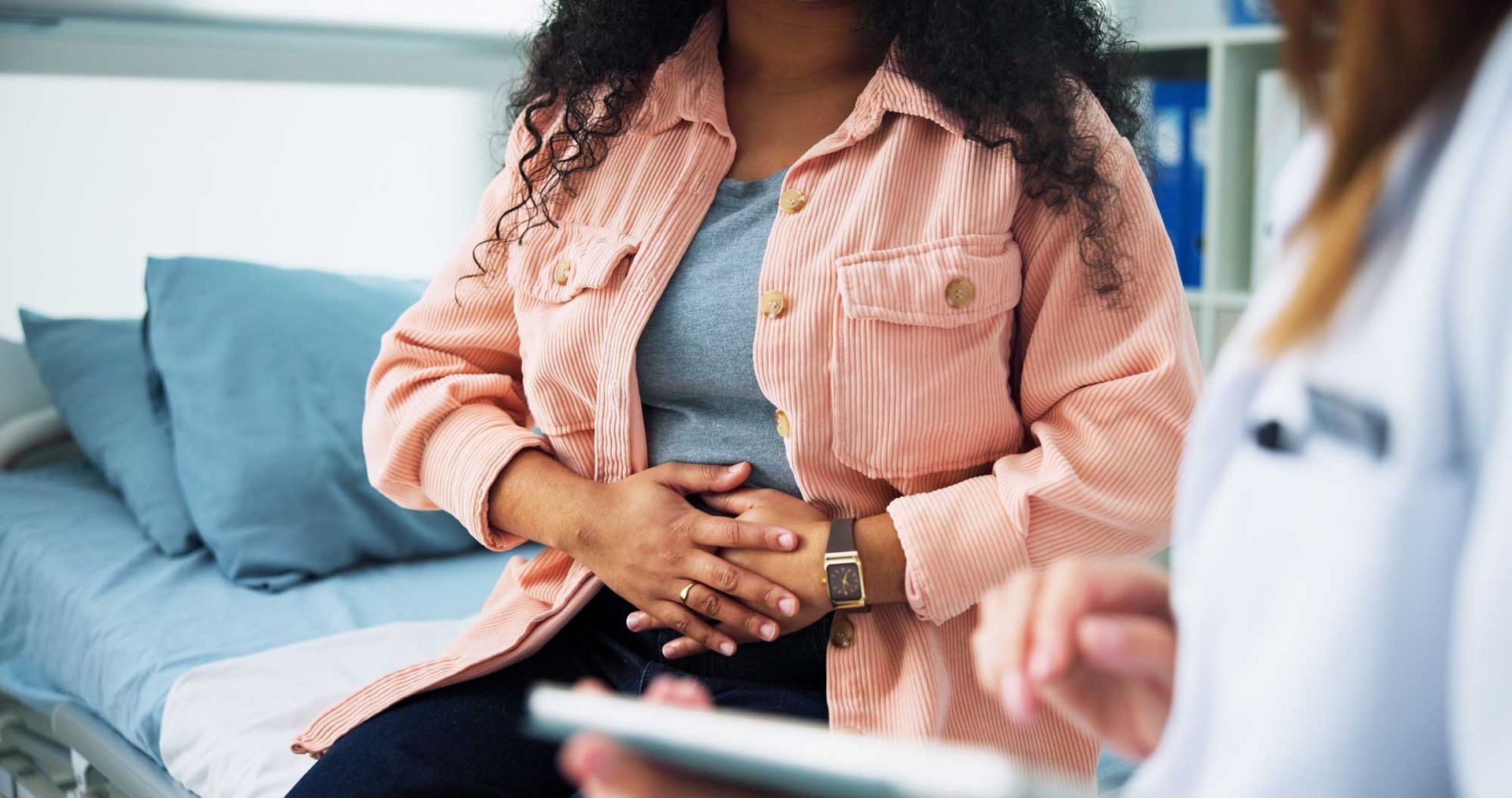 Patient exploring fertility treatment options during a medical consultation with her doctor.