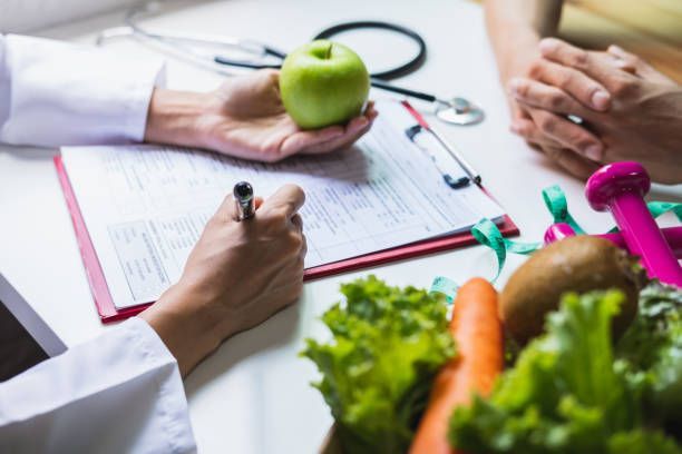Weight management treatment at West End Obstetrics & Gynecology in Richmond, VA, with a nutritionist advising a patient