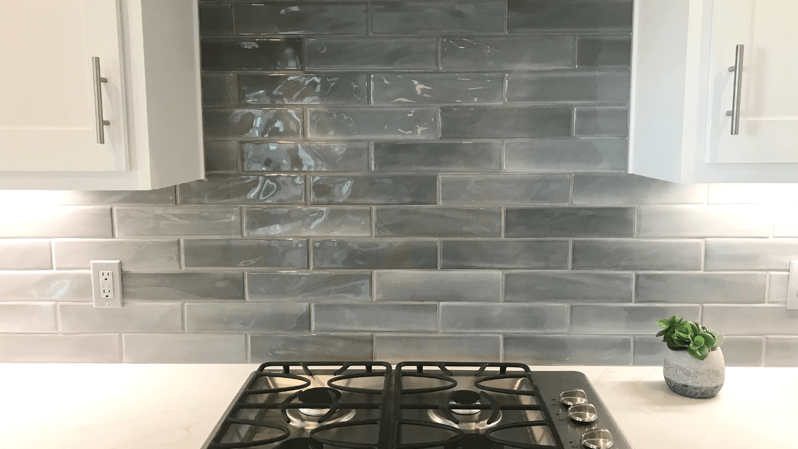 A stove top oven is sitting on top of a counter in a kitchen.