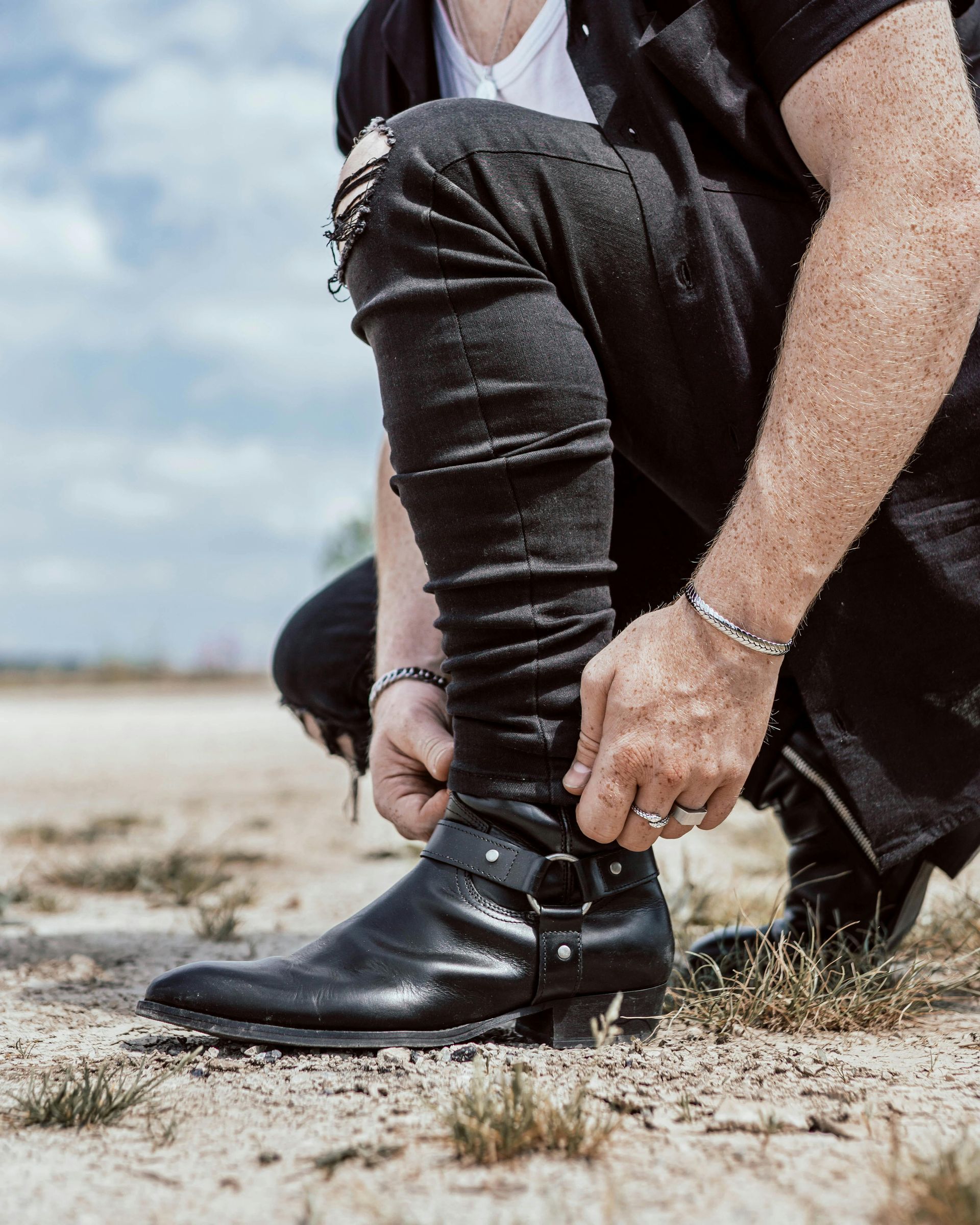 a person tying their shoes