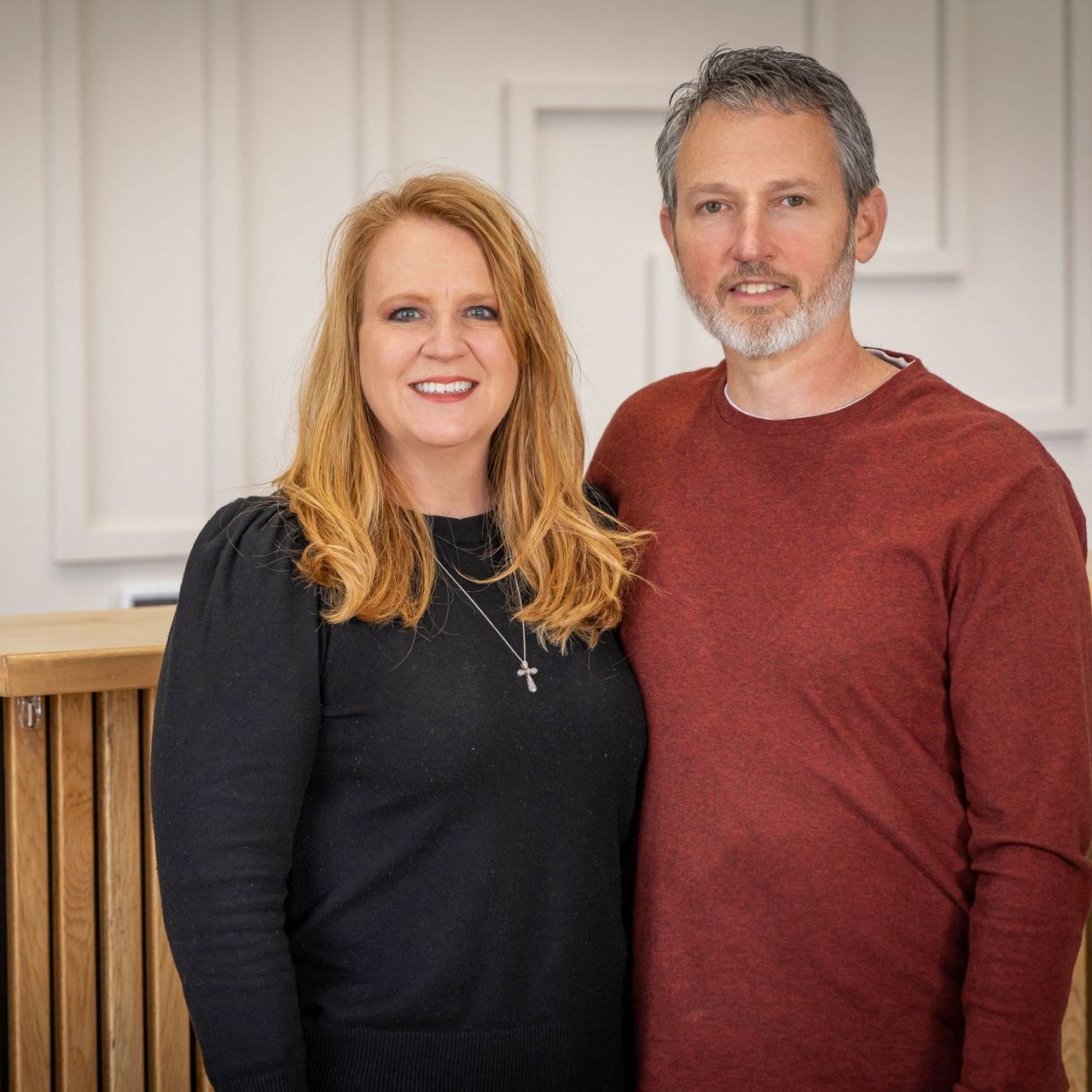 A man and a woman are posing for a picture together.